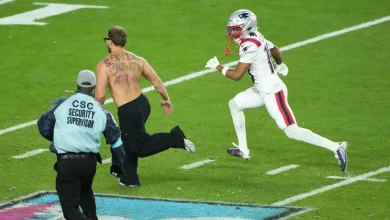 Fan on the field at Super Bowl 60 briefly halts play
