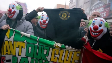 Man United fans wear clown masks in latest protest at club's owners
