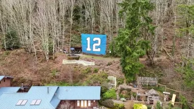 Meet the Issaquah duo behind the giant '12' banner that overlooks I-90