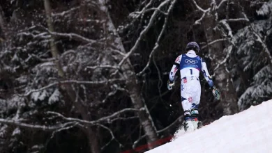Olympic skier throws poles, heads for woods after skiing out with gold in reach