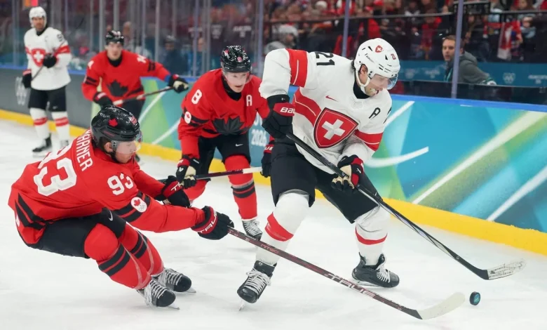 Switzerland’s Kevin Fiala stretchered off the ice against Canada at Olympics