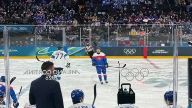 The boards at the main Olympic hockey arena in Italy will be changed to a lighter color for the rest of play after feedback from players