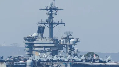US carrier shoots down Iranian drone and armed boats threaten US tanker as tensions with Iran escalate