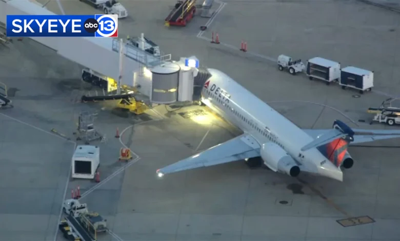 Unruly passenger did not access cockpit on Atlanta-bound aircraft, leading back to diversion to Hobby Airport, officials say.