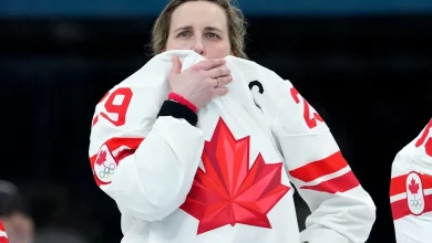 With her knee taped up for the gold medal final, Poulin hid the pain from her Canadian teammates
