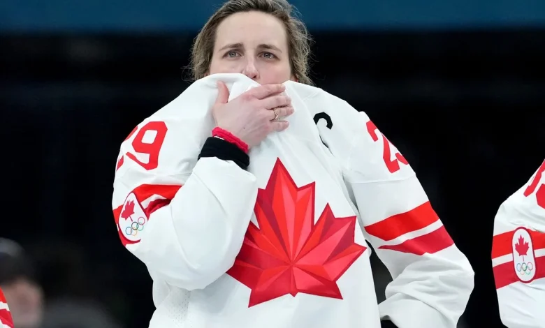 With her knee taped up for the gold medal final, Poulin hid the pain from her Canadian teammates