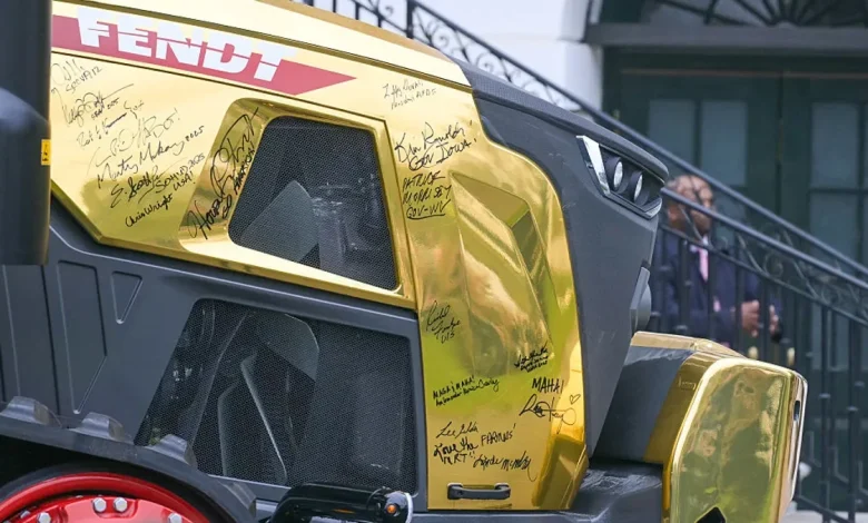 'A beautiful tractor’: Trump pauses to admire gold tractor
