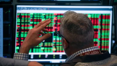 Dow tumbles more than 800 points as tariff uncertainty and AI disruption fears roil markets