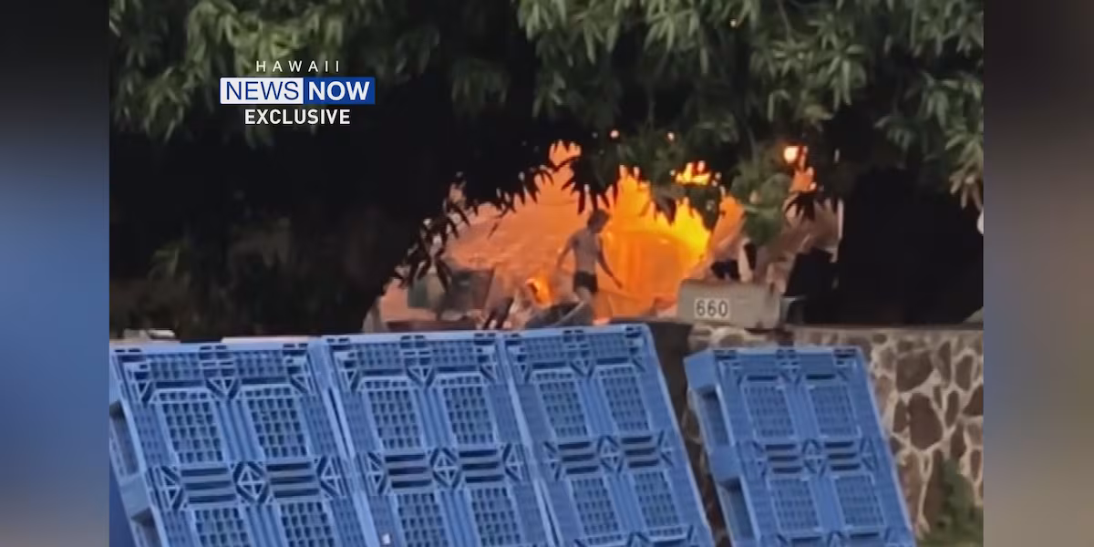 EXCLUSIVE: Video shows Aina Haina man moving rubble as fire burns nearby