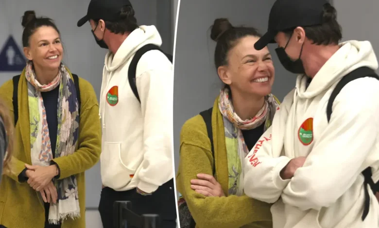Hugh Jackman and Sutton Foster look more in love than ever while arriving at LAX