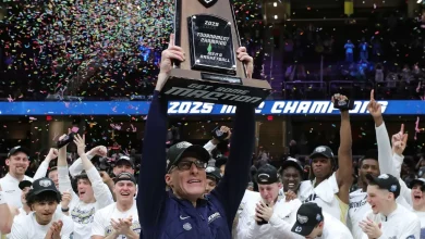 Longtime Akron Zips basketball coach John Groce is hired by Charleston