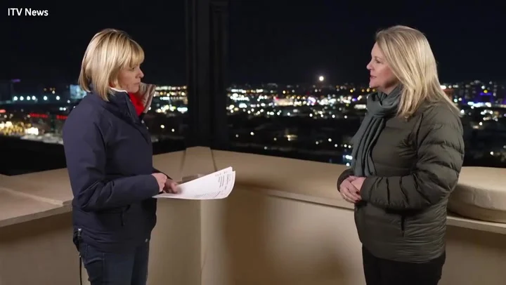 Moment rocket intercepted behind news presenters reporting on Iran airstrikes