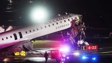 Plane and fire-rescue truck collide at New York's LaGuardia Airport, 2 pilots killed, officials say