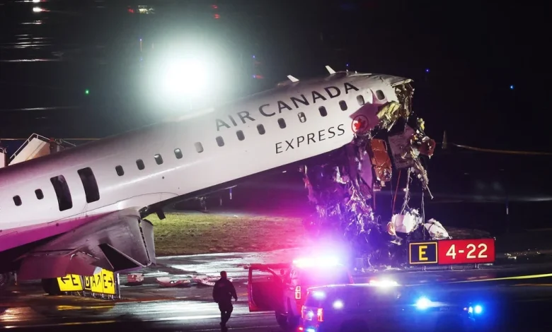 Plane and fire-rescue truck collide at New York's LaGuardia Airport, 2 pilots killed, officials say