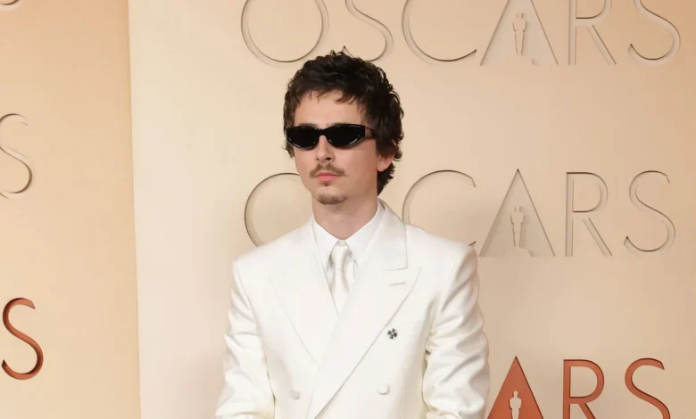 Timothée Chalamet Goes Full Y2K Boy Band in a White Suit and Goatee on the 2026 Oscars Red Carpet