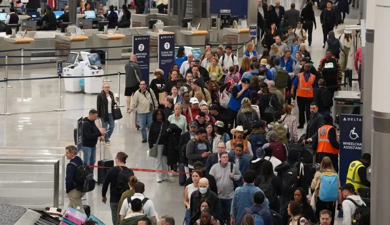 Travelers face unpredictable airport wait times as TSA officers go unpaid
