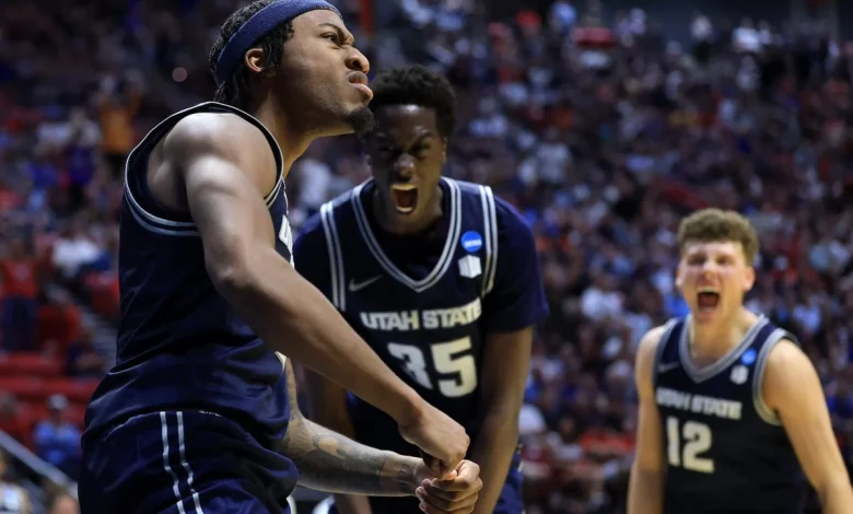 Utah State can’t match college basketball’s spending or keep a coach. It wins anyway