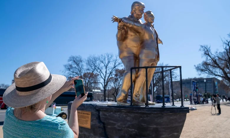 ‘Titanic’ statue of Trump and Epstein on the Mall draws praise, scorn