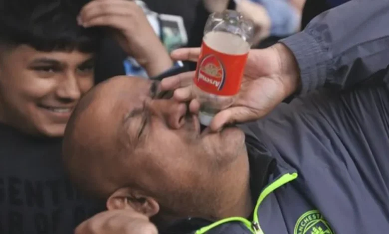 Bottle job? Man City fan celebrates with Arsenal taunt as Chelsea rout narrows title gap