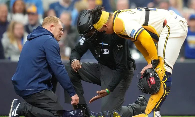CB Bucknor leaves game after taking foul tip to facemask