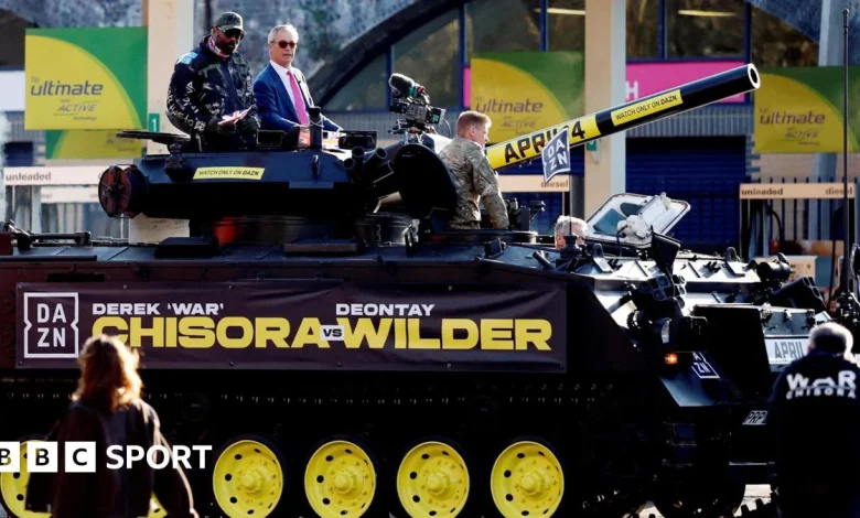 Chisora vs Wilder: Chisora arrives at news conference in a tank with Nigel Farage