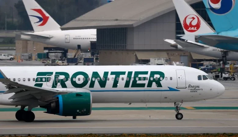 Close call at LAX: Frontier Airlines jet slams on the brakes when two trucks cross its path