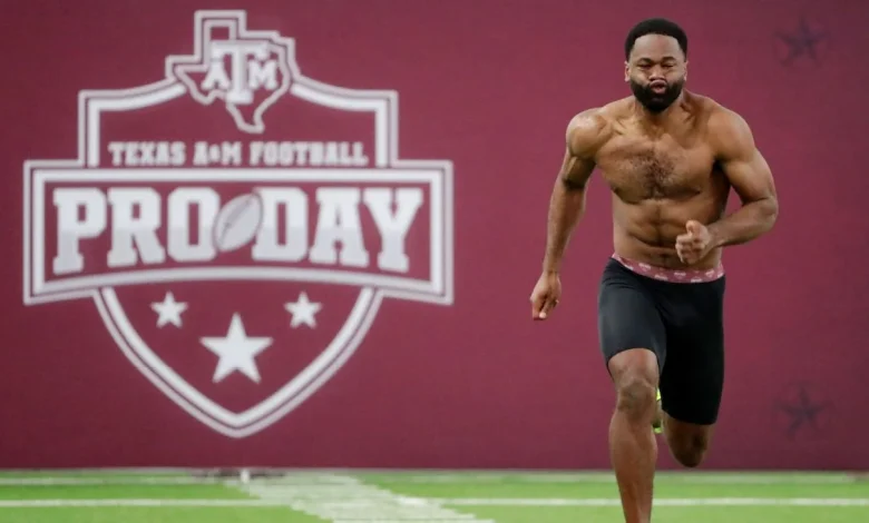 Cowboys visit with Emmitt's son, Texas A&M RB E.J. Smith