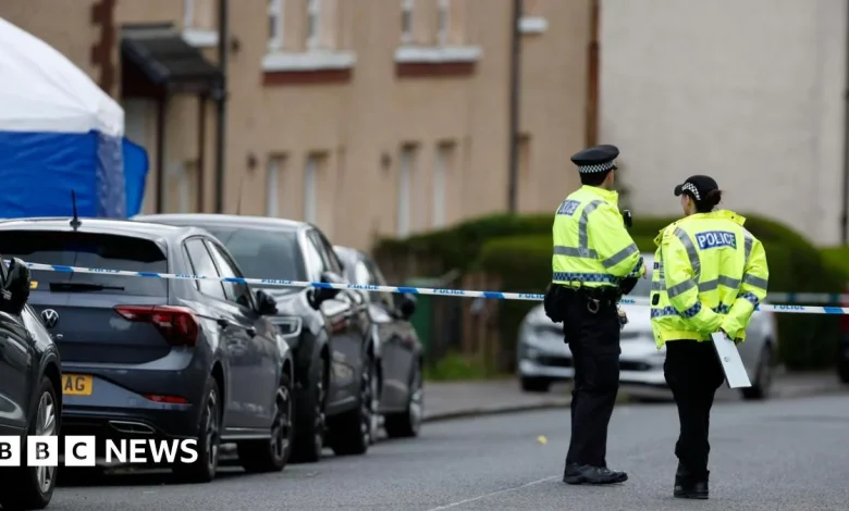 Detectives probe suspicious death of woman found on street