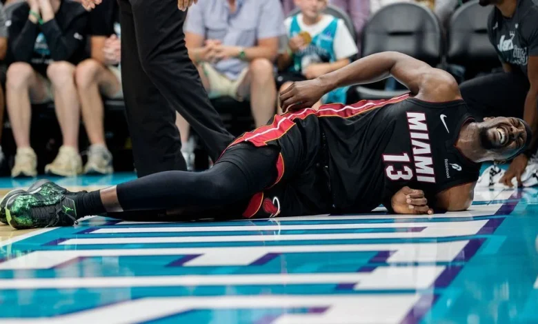 Heat's Bam Adebayo limps off after tumble with LaMelo Ball