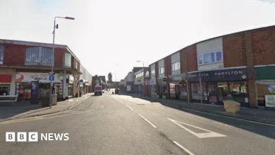 One person taken to hospital after car hits building