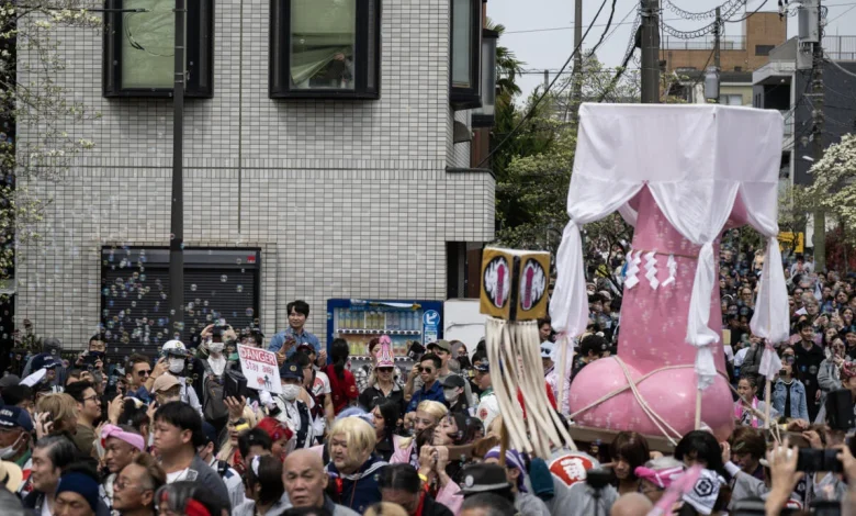 Revellers parade giant penises to dash stigma in Japan's fertility festival