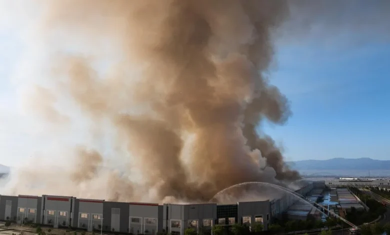 Roof collapses, firefighters retreat as massive paper warehouse goes up in flames