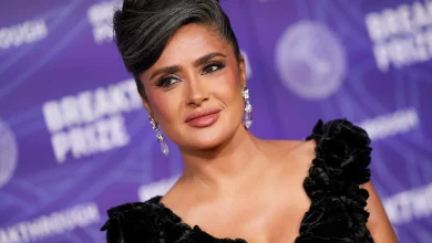 Salma Hayek Embraces Her Natural Gray Hair in a Swooping Updo With a Plunging Sheer LBD