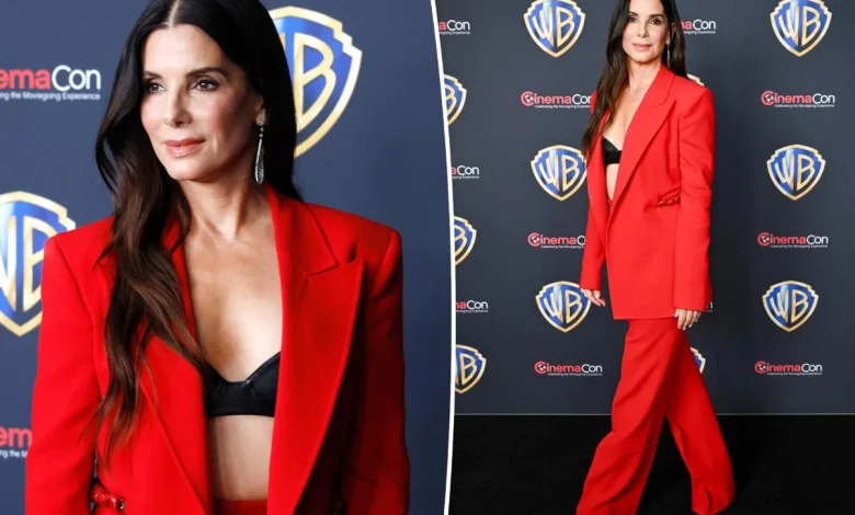 Sandra Bullock wows in red-hot pantsuit on CinemaCon 2026 red carpet