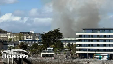 Smoke bellows from derelict hotel on fire