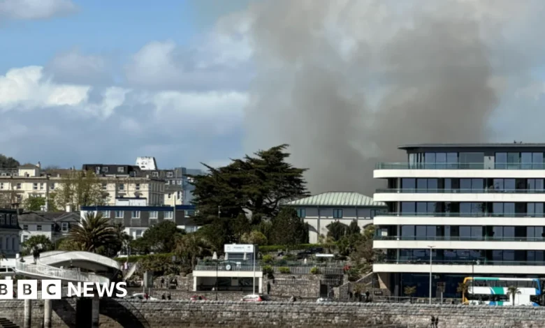 Smoke bellows from derelict hotel on fire