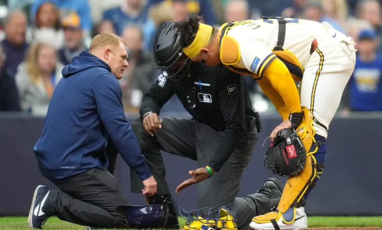 Umpire CB Bucknor leaves game after taking a foul ball off his facemask