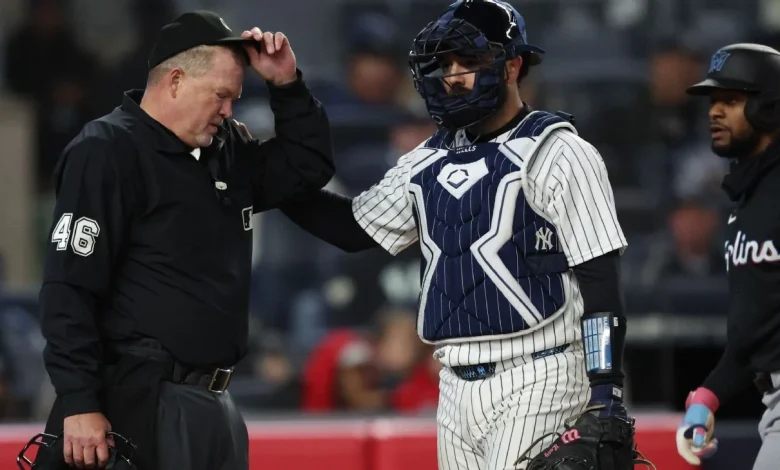 Umpire Ron Kulpa leaves Marlins-Yankees after foul ball hits mask