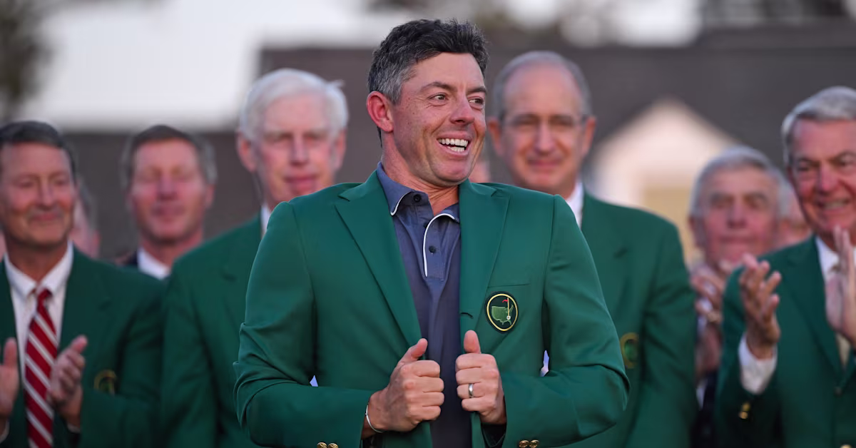 Who awards the Masters champion his green jacket if the winner is the defending champion?