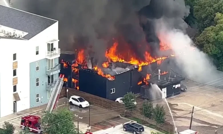 At least 1 injured in reported explosion at Dallas apartment building as crews battle massive fire