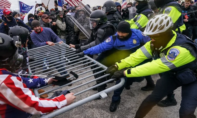 Officers who defended Capitol from rioters sue to block payouts from fund : NPR