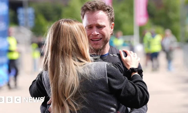 Olly Murs in tears as he completes endurance feat