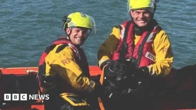 RNLI volunteer swims to the rescue of stranded dog
