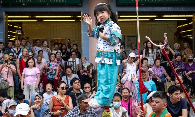 Revelers pack a Hong Kong island for a bun festival, a century-old tradition
