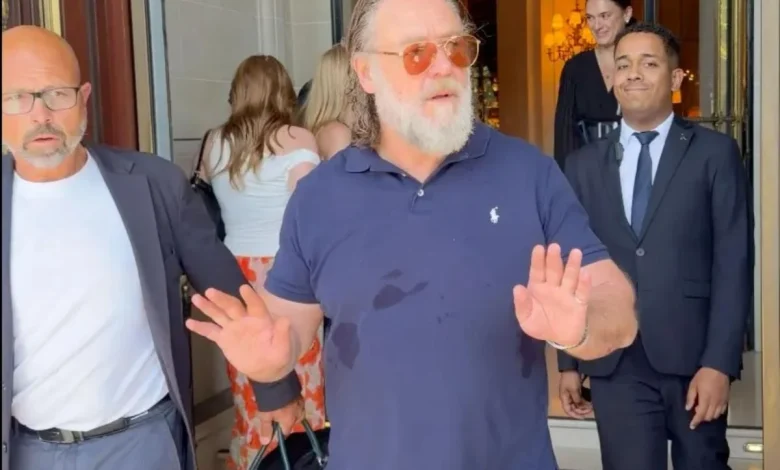 Russell Crowe warns autograph hunters gathered outside his Paris hotel: 'Don't f--king push in on me'
