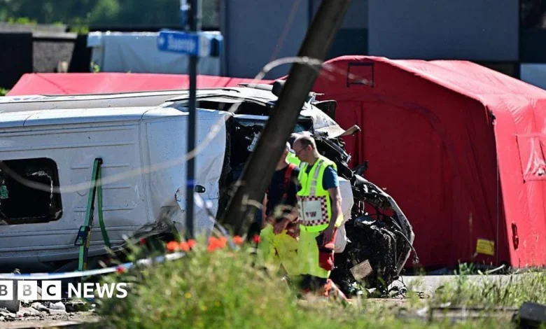 Several killed as train and school bus collide in Belgium, local media report