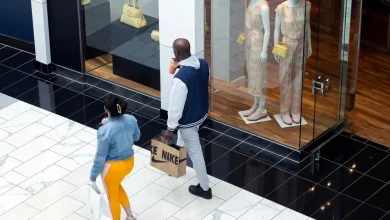 US consumer sentiment falls as Dow hits record