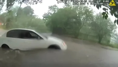 Video shows infant being rescued from car trapped in Texas floodwaters