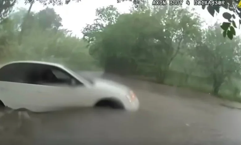 Video shows infant being rescued from car trapped in Texas floodwaters