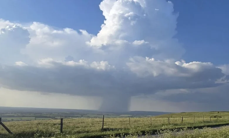 ‘Surreal’ storm breaking over town spotted from Wiltshire landmark amid heatwave